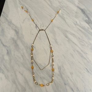 Gold layered necklace with beads and stones